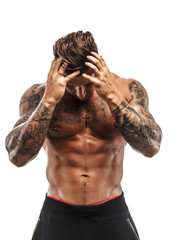 Awesome muscular man with tattoo