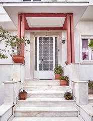 vintage house entrance and flowerpots, Athens Greece