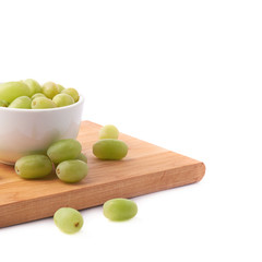 White grapes in a ceramic bowl isolated