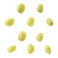 Five single white grapes isolated