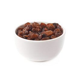 Cup filled with raisins isolated