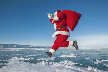Santa Claus running in the winter