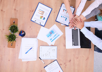 Business team with hands together - teamwork concepts