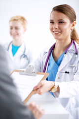 Fototapeta premium Medical team sitting at the table in modern hospital