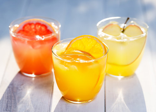Fresh fruit juice from oranges apples pink grapefruit