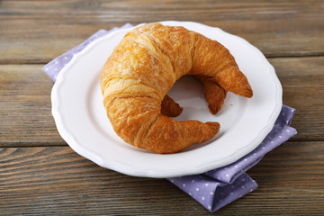 Delicious croissant on a plate