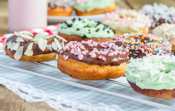 Homemade colorful donuts on a cooling rack