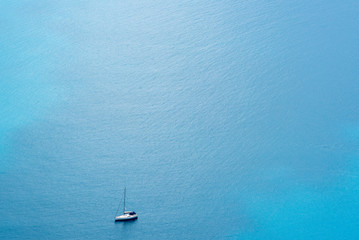 Sailing boat in the Mediterranean seen from a distance