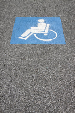 Symbol of the handicapped person painted on the asphalt
