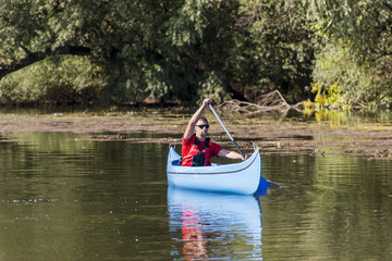 Fototapeta na wymiar Young man in canoe