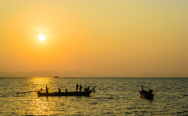 Fototapeta na wymiar Fishermen are out fishing , Sunrise