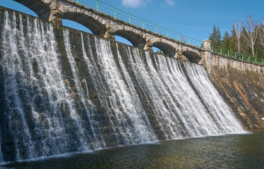 The dam and waterfall on the river Åomnica in Karpacz.