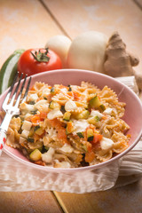 pasta with tomatoes zucchinis and scamorza cheese, bokeh effect