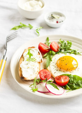 fried egg, vegetable salad and a grilled cheese sandwich 