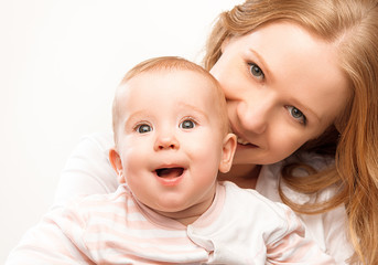 happy family mother and baby daughter hugging