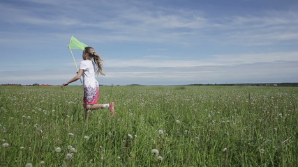 Young girl running with butterfly net