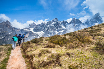 Fototapeta na wymiar Hikers on Alps Mountain Trail