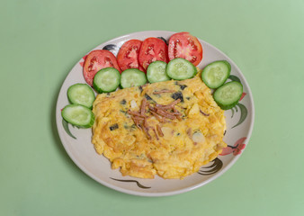 seaweed and squid omelette with tomato and cucumber on the white dish © lamart1971