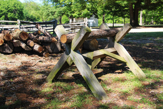 The old wooden sawhorse on the summer country farm scene