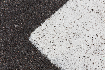 Closeup of a  asphalt pavement texture with a white line painted