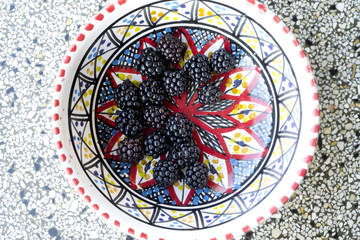 blackberries in bowl on sink