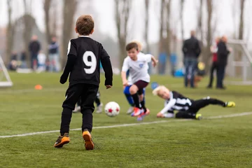 Tuinposter Youth soccer match © Mikkel Bigandt