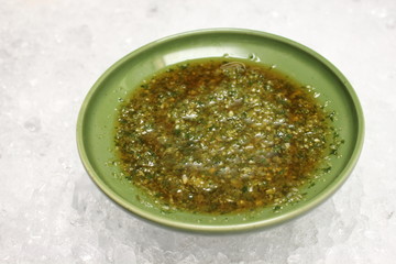 Mexican green sauce made of onions green tomatoes herbs and a lo