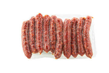 Smoked sausages wrapped in plastic on a white background. Isolated.