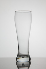 Empty glass of beer on white background