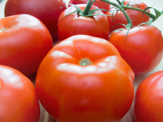 Fresh tomatoes on rustic wooden background