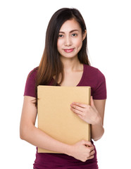 Young woman holding with her homework