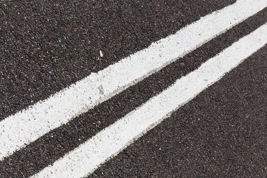 Asphalt Road With White Double Solid Line.