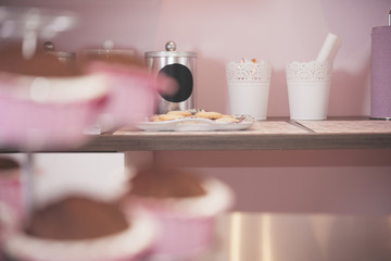 Young woman chef cooking cake in kitchen
