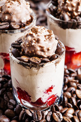 Coffee and chocolate dessert with ice cream and strawberries, se