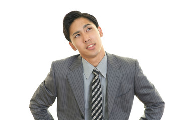 疲れた表情のビジネスマン