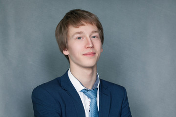 Portrait of happy schoolboy teenager