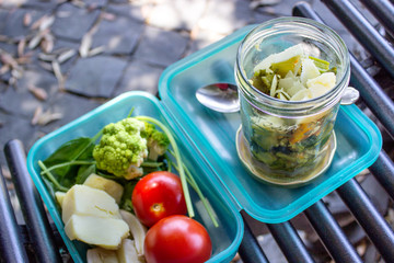 Refreshments / Box with a healthy lunch on a bench