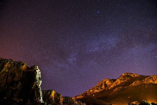 The starry sky above rocky dolomite