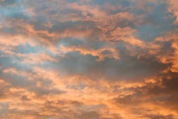Naklejka na ściany i meble Dramatic cloud on evening sky. Sunset over ocean.