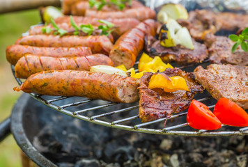 Assorted grilled meat with vegetable on a barbecue