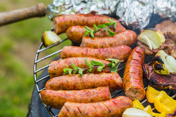 Assorted grilled meat with vegetable on a barbecue