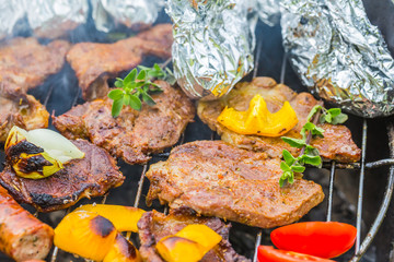 Assorted grilled meat with vegetable on a barbecue
