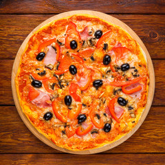 Delicious pizza with salami, mushrooms and olives