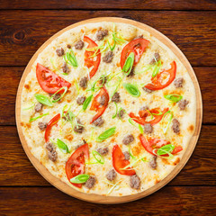 Delicious seafood pizza with tomatoes