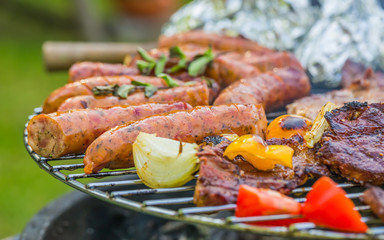 Assorted delicious grilled meat with vegetable on a barbecue