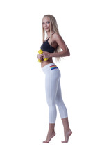 Sporty blonde posing barefoot standing on tiptoe