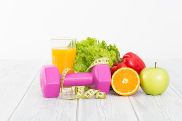 Fitness equipment and healthy food.