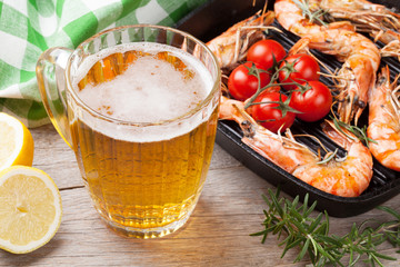 Beer mug and grilled shrimps