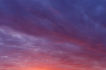 Naklejka na ściany i meble view on cloudy sky at sunset