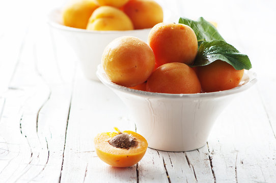 Fresh sweet apricots on the wooden table